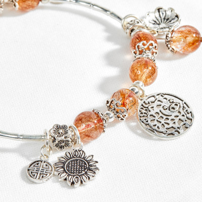 Vòng thạch anh tóc đỏ phối charm heo tài lộc Ngọc Quý Gemstones